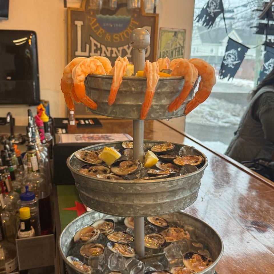 A three-tiered seafood tower with shrimp, oysters, and clams on ice at Willys Pub & Grub.